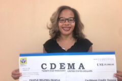 Ms Denise Garfield - CCCU with Cheque donation to CDEMA
