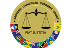 Circular logo for the Eastern Caribbean Supreme Court with a scale in the middle and surrounded by flags of the eastern caribbean countries